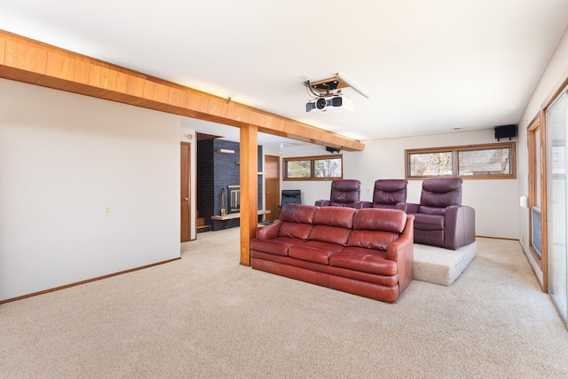 living room featuring a fireplace, baseboards, and light carpet