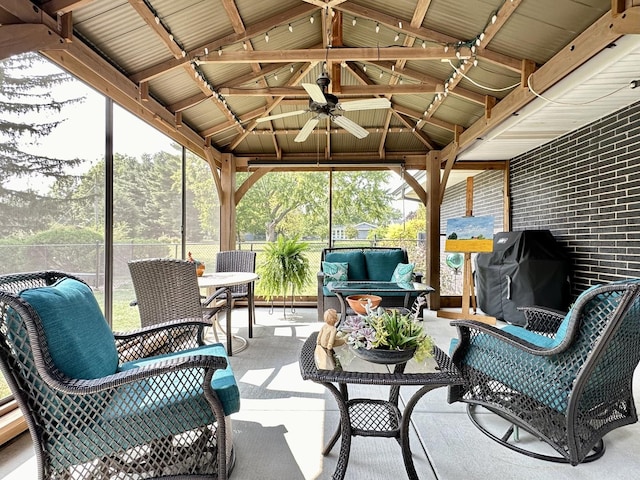 view of patio featuring area for grilling, ceiling fan, a gazebo, an outdoor hangout area, and a lanai