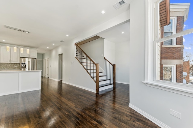 living room featuring recessed lighting, visible vents, baseboards, stairway, and dark wood finished floors