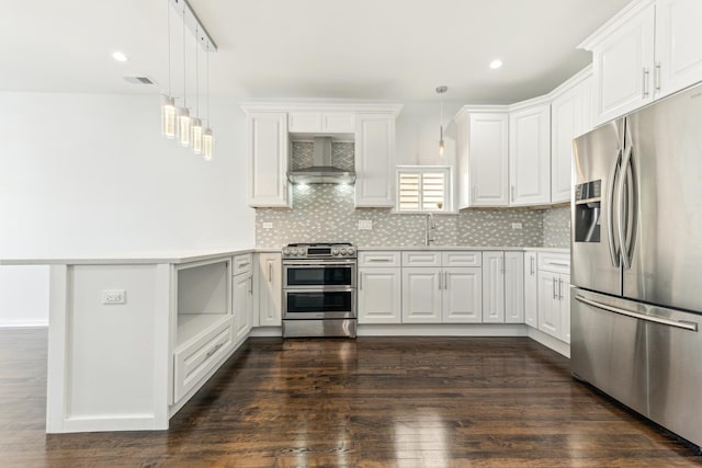 kitchen featuring a sink, visible vents, appliances with stainless steel finishes, wall chimney range hood, and decorative backsplash