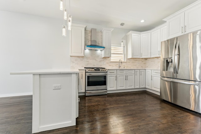 kitchen with stainless steel appliances, wall chimney exhaust hood, white cabinets, and light countertops