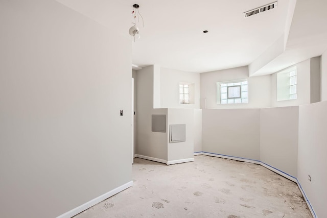 empty room featuring visible vents and baseboards