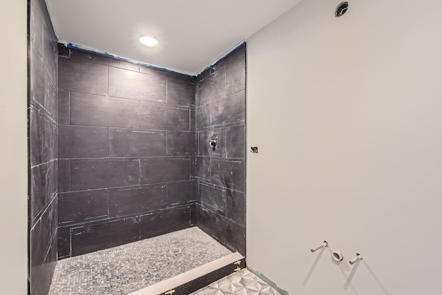 bathroom with tiled shower