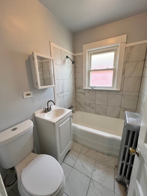 full bath with toilet, radiator heating unit,  shower combination, marble finish floor, and vanity