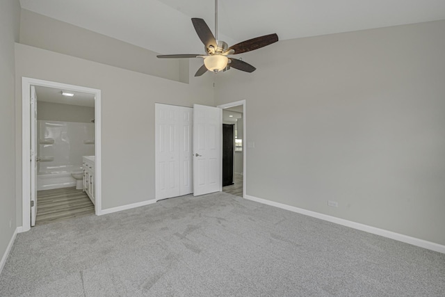 unfurnished bedroom with light carpet and baseboards