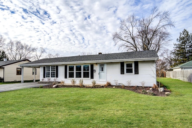 ranch-style house featuring aphalt driveway, fence, a front lawn, and roof with shingles