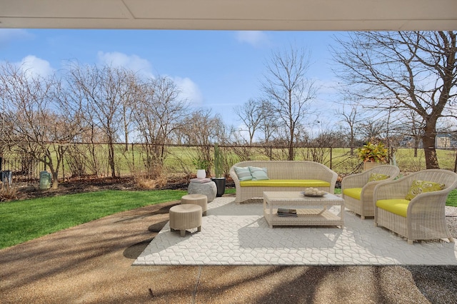 view of patio with an outdoor hangout area and fence