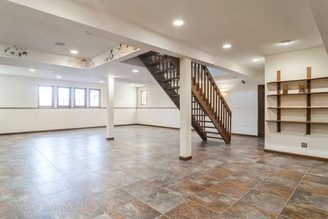 basement featuring stairs, recessed lighting, and baseboards