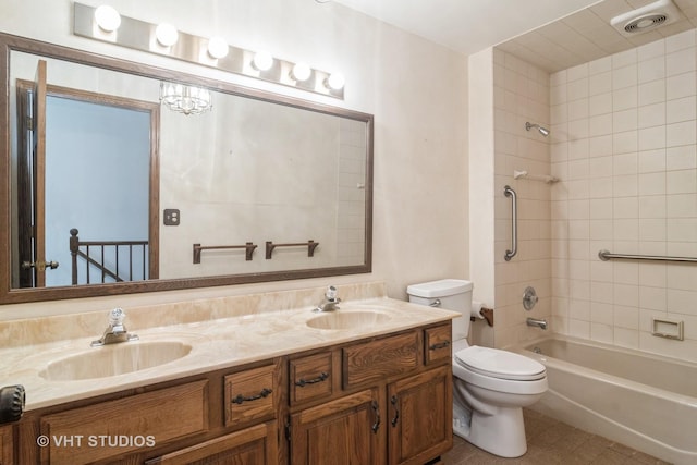 bathroom featuring toilet, shower / tub combination, double vanity, and a sink