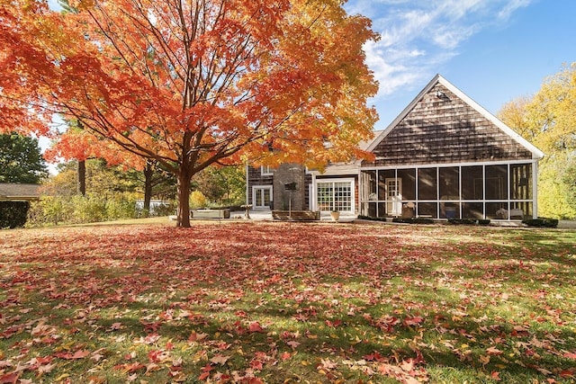 back of house with a sunroom