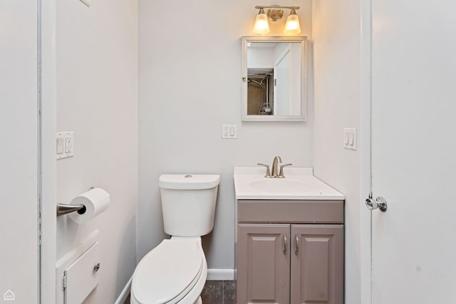1652 W Jarvis Ave, Chicago, IL 60626 - bathroom with toilet, vanity, and baseboards