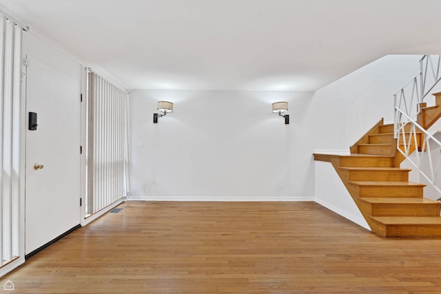 1652 W Jarvis Ave, Chicago, IL 60626 - entrance foyer featuring stairway, light wood-style floors, and baseboards