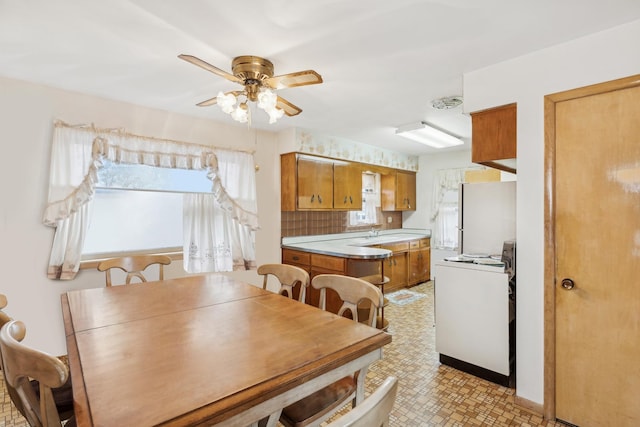 dining space featuring ceiling fan