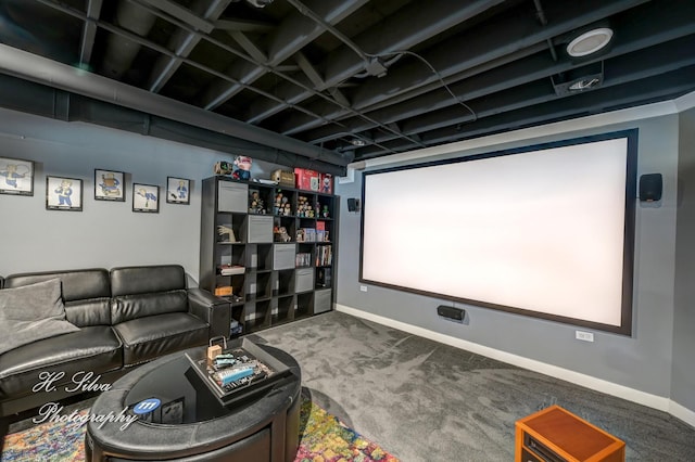 carpeted home theater room with baseboards