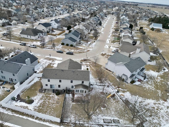 snowy aerial view featuring a residential view