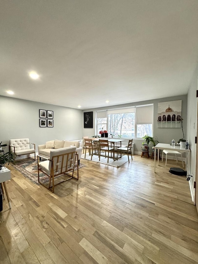 living room with recessed lighting and light wood finished floors