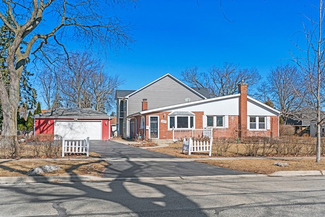 ranch-style house with brick siding and a chimney