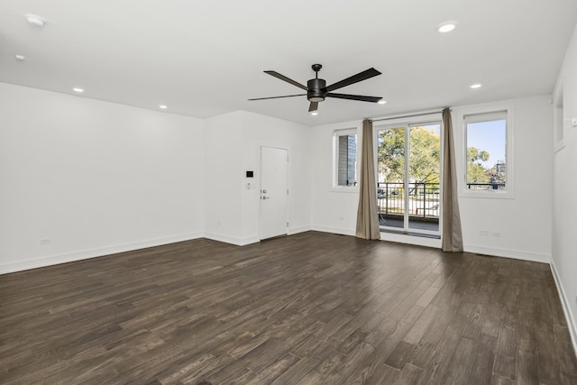 unfurnished living room with dark wood-style floors, recessed lighting, ceiling fan, and baseboards