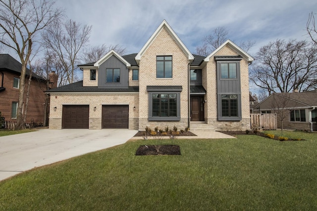 view of front of property with concrete driveway, an attached garage, a front yard, board and batten siding, and brick siding