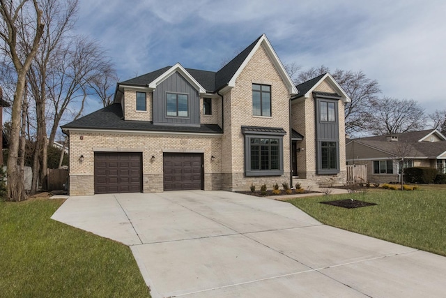 view of front of house with brick siding, concrete driveway, board and batten siding, a front yard, and a garage