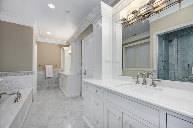 bathroom featuring a garden tub, two vanities, a sink, a shower stall, and crown molding