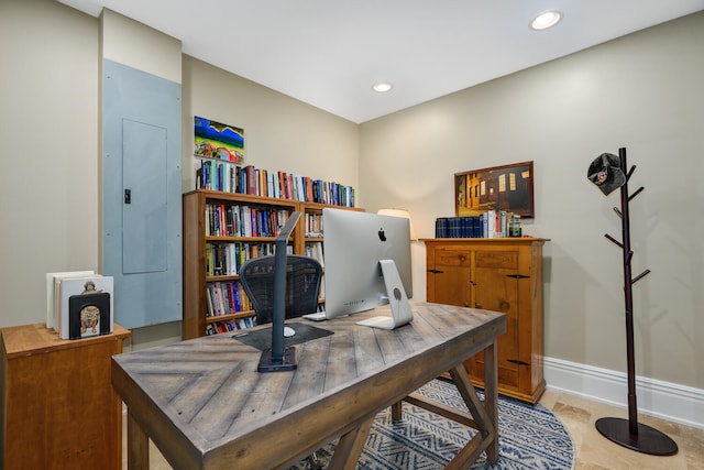 office area with baseboards, electric panel, and recessed lighting