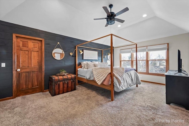 carpeted bedroom featuring wooden walls, baseboards, a ceiling fan, vaulted ceiling, and recessed lighting