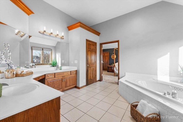 full bathroom with tile patterned flooring, a bath, and vanity