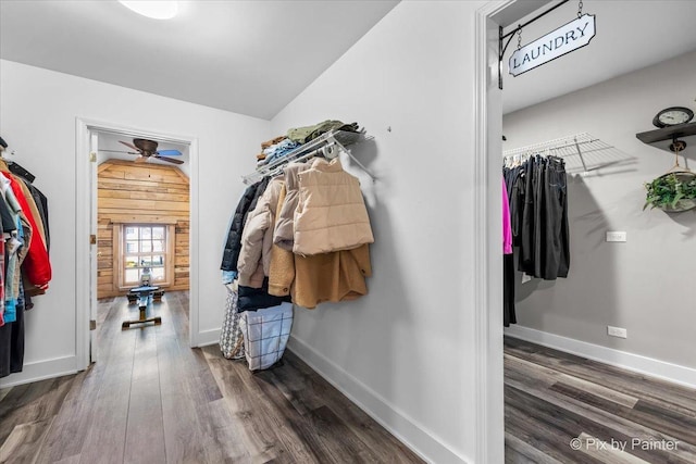 walk in closet featuring ceiling fan, vaulted ceiling, and wood finished floors