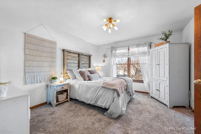 carpeted bedroom featuring baseboards