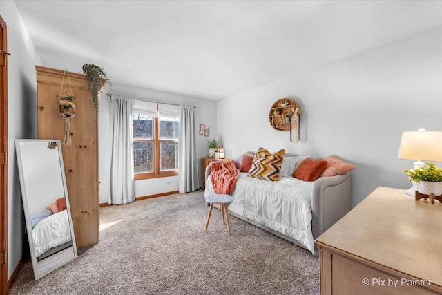 living area with light colored carpet and baseboards