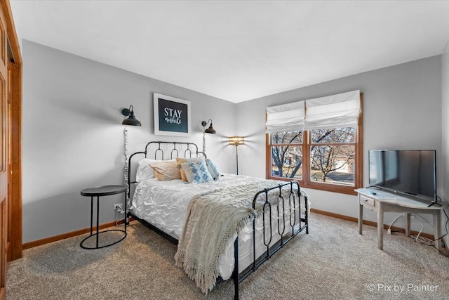 carpeted bedroom with baseboards