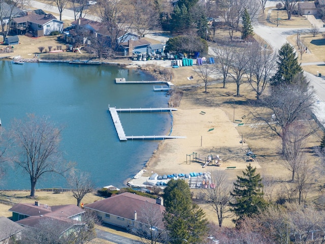 drone / aerial view featuring a water view and a residential view