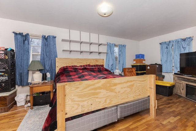 bedroom with wood finished floors