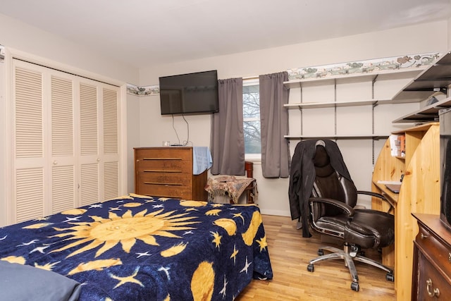 bedroom featuring a closet and wood finished floors