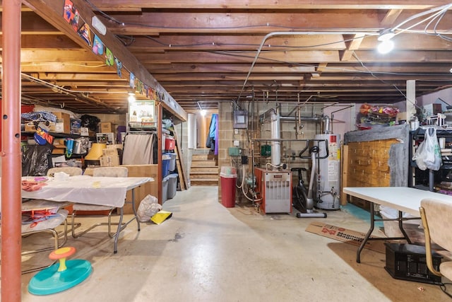 unfinished below grade area with stairs, water heater, and a heating unit