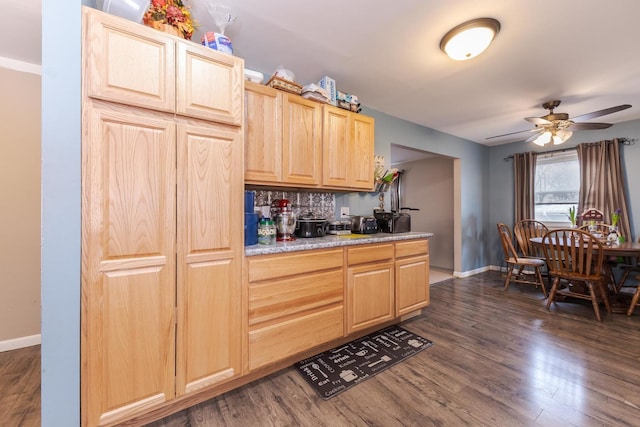 kitchen featuring ceiling fan, light brown cabinets, dark wood-type flooring, baseboards, and light countertops