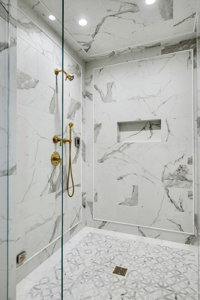 full bathroom featuring a marble finish shower and recessed lighting