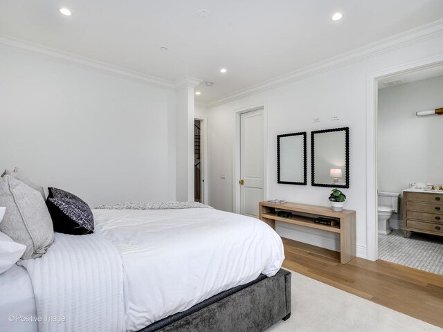 bedroom featuring crown molding, recessed lighting, connected bathroom, light wood-type flooring, and baseboards