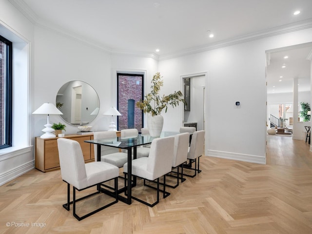 dining area featuring baseboards, ornamental molding, and recessed lighting