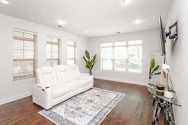 living area featuring dark wood finished floors, visible vents, recessed lighting, and baseboards