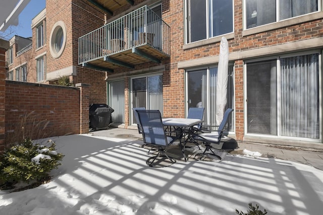 view of patio with outdoor dining space and a grill