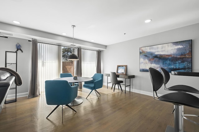 dining area with dark wood-type flooring, recessed lighting, and baseboards