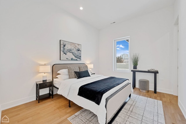 bedroom featuring light wood-style floors, baseboards, and recessed lighting