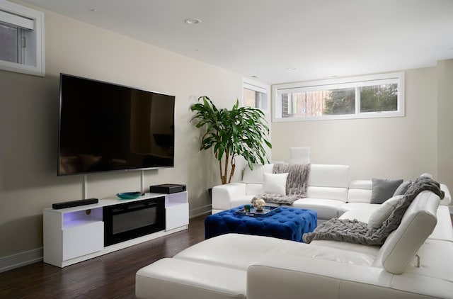 living room with recessed lighting, wood finished floors, and baseboards