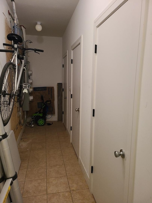 hallway featuring light tile patterned floors