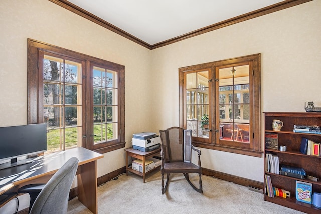carpeted office featuring crown molding and baseboards