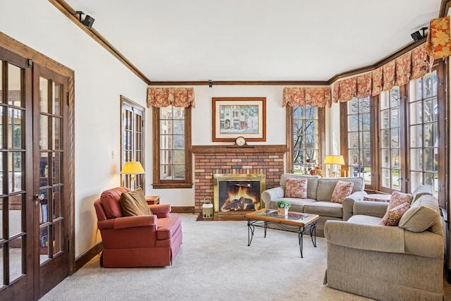 living room featuring carpet, a brick fireplace, baseboards, and ornamental molding