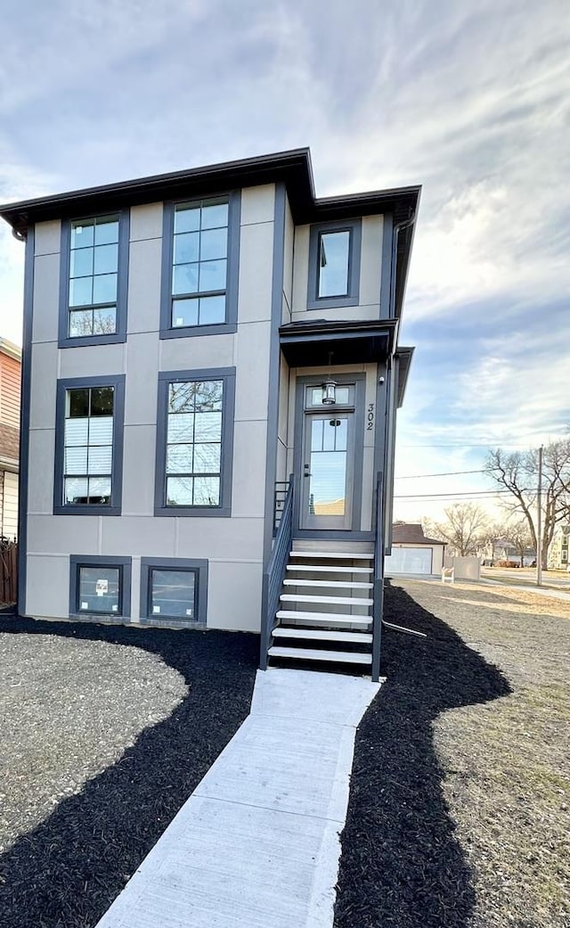 view of exterior entry with stucco siding