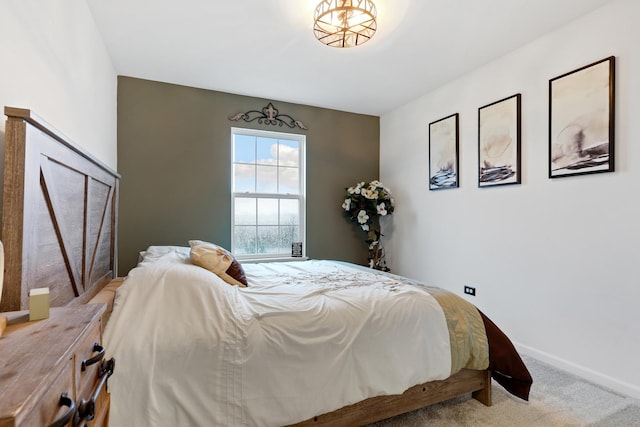 bedroom featuring carpet flooring and baseboards